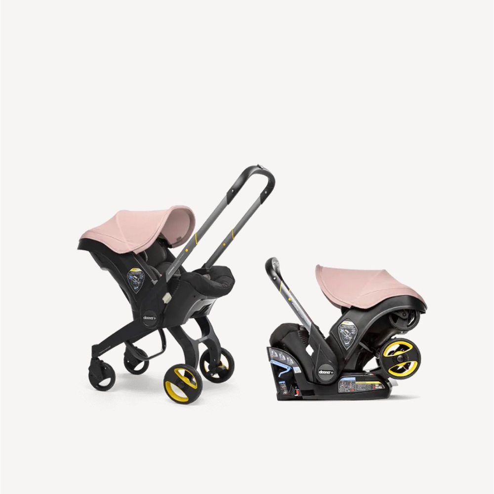 pink and black doona car seat